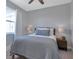 Cozy bedroom with a queen-size bed and light gray walls at 9978 Audrey St, Port Charlotte, FL 33981