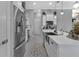 Modern kitchen featuring stainless steel refrigerator and white shaker cabinets at 9978 Audrey St, Port Charlotte, FL 33981