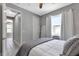 Bright bedroom with a queen bed and access to a hallway bathroom at 9978 Audrey St, Port Charlotte, FL 33981