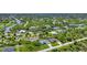 Aerial view of a waterfront community with luxury homes at 9978 Audrey St, Port Charlotte, FL 33981