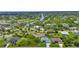 Aerial view of a house and surrounding waterfront community at 9978 Audrey St, Port Charlotte, FL 33981