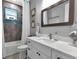 Modern bathroom with white vanity and quartz countertop at 9978 Audrey St, Port Charlotte, FL 33981