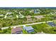 Aerial view of homes and a canal in a tranquil residential neighborhood at 9978 Audrey St, Port Charlotte, FL 33981