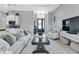 Open living area with a view into the kitchen and entryway at 9978 Audrey St, Port Charlotte, FL 33981