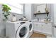 Bright laundry room with Whirlpool washer and dryer at 9978 Audrey St, Port Charlotte, FL 33981