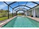 Inviting screened pool with a fountain feature at 9978 Audrey St, Port Charlotte, FL 33981