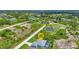 Aerial view of a house with a pool in a residential area at 9978 Audrey St, Port Charlotte, FL 33981