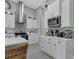White kitchen with stainless steel appliances and a coffee bar at 9978 Audrey St, Port Charlotte, FL 33981