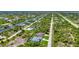 Aerial view showcasing a waterfront community with numerous houses at 9978 Audrey St, Port Charlotte, FL 33981