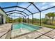 Resort-style screened pool with fountain at 9978 Audrey St, Port Charlotte, FL 33981