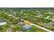 Aerial view of a house with a pool in a residential neighborhood at 9978 Audrey St, Port Charlotte, FL 33981