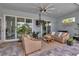 Covered patio with comfortable seating and a ceiling fan at 9978 Audrey St, Port Charlotte, FL 33981