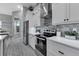 Clean kitchen with stainless steel appliances and gray backsplash at 9978 Audrey St, Port Charlotte, FL 33981