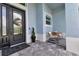 Relaxing front porch with rocking chairs and stylish decor at 9978 Audrey St, Port Charlotte, FL 33981