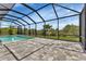 Large screened pool with patio area at 9978 Audrey St, Port Charlotte, FL 33981