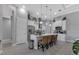 Modern kitchen with white cabinets, stainless steel appliances, and an island at 9978 Audrey St, Port Charlotte, FL 33981