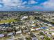 Wide aerial view of a neighborhood with single-Gathering homes near a river at 22062 Marshall Ave, Port Charlotte, FL 33952