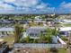 Charming single-story home with a well-maintained lawn and white picket fence in a quiet neighborhood at 22062 Marshall Ave, Port Charlotte, FL 33952