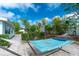 Secluded backyard with lush landscaping and a comfortable hammock at 22062 Marshall Ave, Port Charlotte, FL 33952