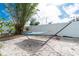 Backyard with a hammock, privacy fence, and shady bamboo at 22062 Marshall Ave, Port Charlotte, FL 33952