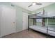 Bedroom with a bunk bed, a ceiling fan and light green walls at 22062 Marshall Ave, Port Charlotte, FL 33952
