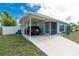 The front exterior featuring an attached carport at 22062 Marshall Ave, Port Charlotte, FL 33952