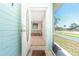 Open view through the front door, showcasing a light and airy foyer with tiled floor at 22062 Marshall Ave, Port Charlotte, FL 33952