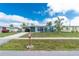 Charming home with a well-manicured lawn and a cozy carport in a desirable neighborhood at 22062 Marshall Ave, Port Charlotte, FL 33952
