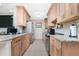 Modern kitchen with light wood cabinets, granite countertops, and stainless steel appliances for the home chef at 22062 Marshall Ave, Port Charlotte, FL 33952