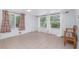 Bright living room with large windows and tile flooring at 22062 Marshall Ave, Port Charlotte, FL 33952