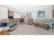 Spacious living room with tile floors, connecting to the dining area for easy entertaining at 22062 Marshall Ave, Port Charlotte, FL 33952