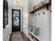 Bright entryway with built-in bench and storage at 43789 Cattleman Dr, Punta Gorda, FL 33982