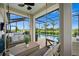 Relaxing pool area with covered patio, seating, and a screened enclosure at 43789 Cattleman Dr, Punta Gorda, FL 33982