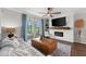 Cozy living room features a fireplace, hardwood floors, and large windows at 43789 Cattleman Dr, Punta Gorda, FL 33982
