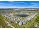 Aerial view showcasing a single-Gathering home in a quiet residential neighborhood at 43789 Cattleman Dr, Punta Gorda, FL 33982