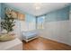Charming Bedroom with light blue walls, crib, and plenty of space for baby at 43789 Cattleman Dr, Punta Gorda, FL 33982