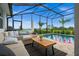 Lush patio with an inviting pool, spa, and comfortable seating at 43789 Cattleman Dr, Punta Gorda, FL 33982