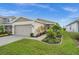 Charming one-story home with a landscaped yard and two-car garage at 43789 Cattleman Dr, Punta Gorda, FL 33982