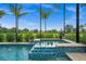 Relaxing spa with a tranquil view from a screened enclosure at 43789 Cattleman Dr, Punta Gorda, FL 33982