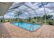 Enclosed rectangular pool with a view of the canal at 2309 Conway Blvd, Port Charlotte, FL 33952