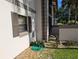Building exterior with brown shutters and landscaping at 1515 Forrest Nelson Blvd # E106, Port Charlotte, FL 33952