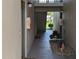 Interior hallway with fire extinguisher and access to units at 1515 Forrest Nelson Blvd # E106, Port Charlotte, FL 33952
