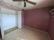 Bedroom with tiled floor and ceiling fan at 1515 Forrest Nelson Blvd # E106, Port Charlotte, FL 33952