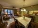 Cozy dining area with wood floors and access to living room at 1515 Forrest Nelson Blvd # E106, Port Charlotte, FL 33952