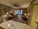 Living room with access to screened patio at 1515 Forrest Nelson Blvd # E106, Port Charlotte, FL 33952