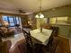 Casual dining area with seating for four and access to living room at 1515 Forrest Nelson Blvd # E106, Port Charlotte, FL 33952