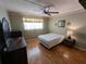Spacious bedroom with laminate flooring and ceiling fan at 1515 Forrest Nelson Blvd # E106, Port Charlotte, FL 33952