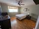 Spacious bedroom with laminate flooring and ceiling fan at 1515 Forrest Nelson Blvd # E106, Port Charlotte, FL 33952