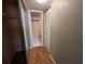A well-lit hallway with mirrored closet doors and a safe at 1515 Forrest Nelson Blvd # E106, Port Charlotte, FL 33952