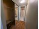 A well-lit hallway with mirrored closet doors and a safe at 1515 Forrest Nelson Blvd # E106, Port Charlotte, FL 33952